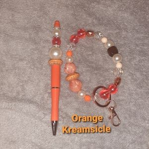 Ink pen & keychain wristlet